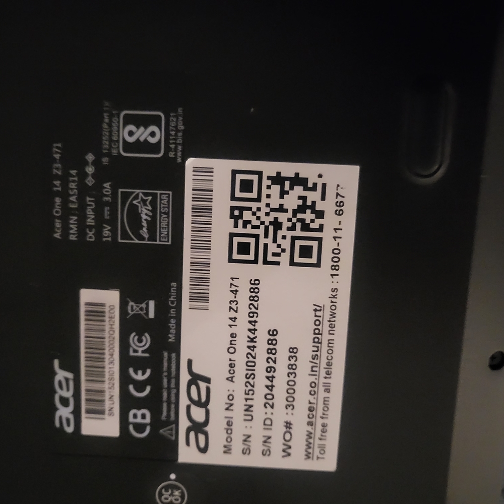 Acer Black Laptop with QR Code and Certification Marks